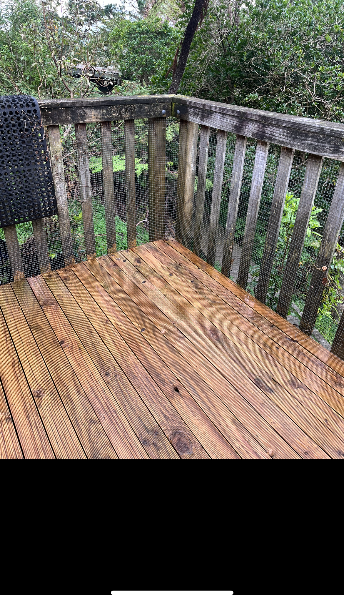 The same timber deck cleaned back to fresh, honey-coloured wood