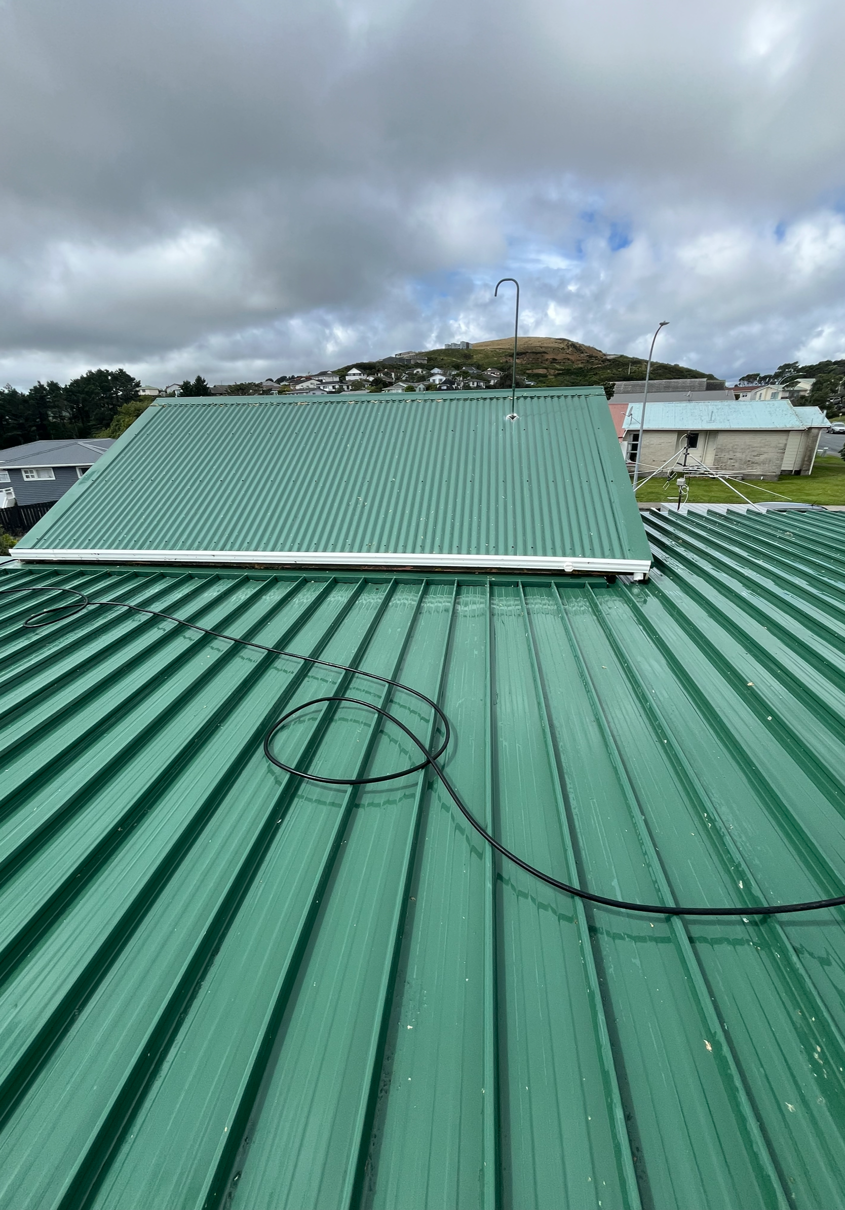 Same metal roof clean after moss removal and a protective treatment